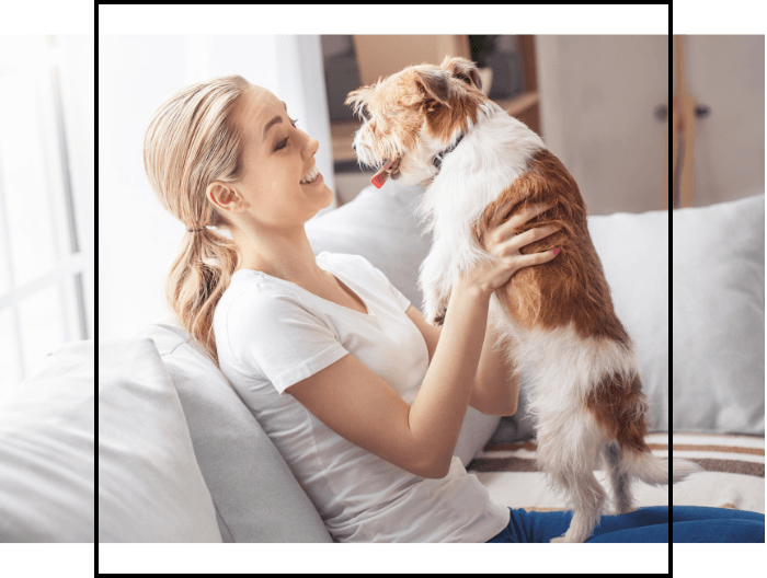 A person holding a dog