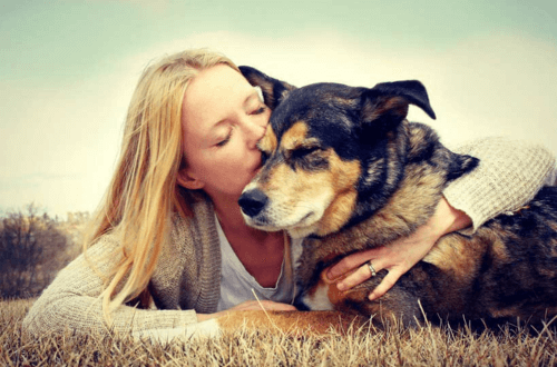 Lady pampering a dog